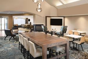 a conference room with a table and chairs at Sonesta ES Suites Dallas Richardson in Richardson