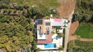 an aerial view of a house with solar panels on it at Pomos Harbourbiew Villa in Pomos
