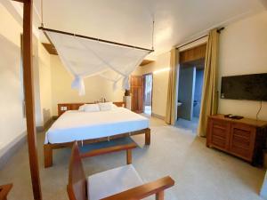 En eller flere senge i et værelse på Quỳnh Viên Resort