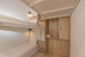 Postel nebo postele na pokoji v ubytování OwlStay Flip Flop Hostel - Garden