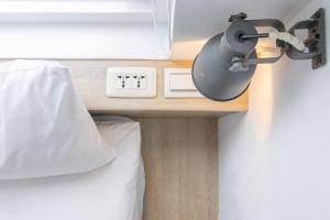 Postel nebo postele na pokoji v ubytování OwlStay Flip Flop Hostel - Garden