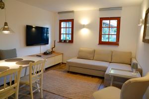 a living room with a couch and a table at Kota27 in Bovec