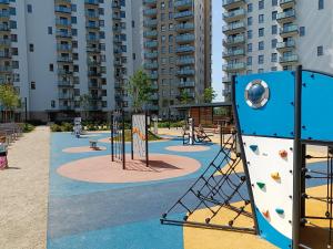 a playground in a apartment complex with a play area at Green Sea Gdańsk in Gdańsk