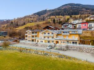 a group of houses on a hill with a road at One Bedroom Apartment with Panoramic views in Piesendorf