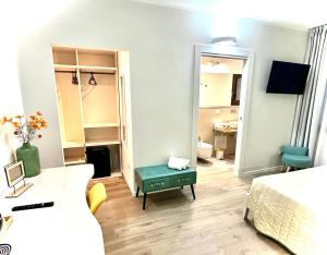 a living room with a bed and a room with a mirror at Karasole in San Teodoro +50 photos