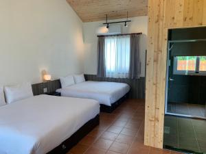 En eller flere senger på et rom på Leju Diary B&B