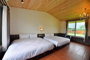 En eller flere senger på et rom på Leju Diary B&B