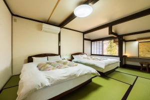 Katil atau katil-katil dalam bilik di Tobise Onsen Tenga Sanso