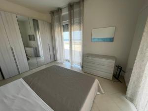 Postel nebo postele na pokoji v ubytování Nautilus Appartamenti a mare