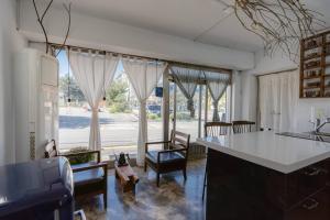 a kitchen with a counter and a large window at Spring Day in Jeonju