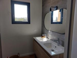 a bathroom with a sink and a mirror at La Belle de Cassis in Cassis +19 photos
