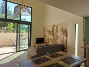 a living room with a couch and a table at La Belle de Cassis in Cassis