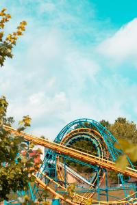a blue roller coaster ride in a park at Netania in L'Ampolla