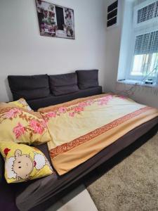 Postel nebo postele na pokoji v ubytování Sétány Apartman