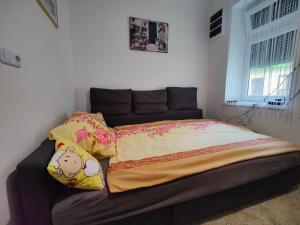 Postel nebo postele na pokoji v ubytování Sétány Apartman
