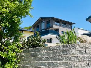 a house on top of a set of stairs at place2be - exclusive apartment in Faistenau