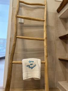 a towel on a towel ladder in a bathroom at La Savina Ses Platgetes in La Savina