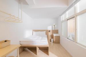 Postel nebo postele na pokoji v ubytování OwlStay Flip Flop Hostel - Garden + 37 fotografií