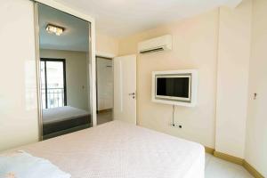 Postel nebo postele na pokoji v ubytování Granada City Residence 51