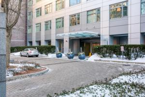 a building with a car parked in front of it at Cambridge 1BR w Gym WD nr Kendall Sq BOS-585 in Cambridge