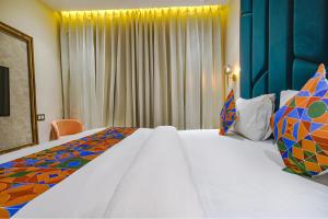 Postel nebo postele na pokoji v ubytování FabHotel Benchmark