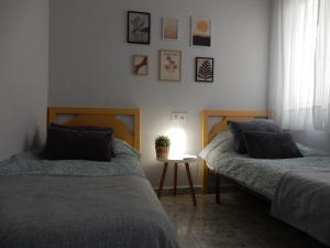 Łóżko lub łóżka w pokoju w obiekcie Apartment Amelia