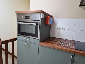 Kuchyň nebo kuchyňský kout v ubytování B&B Bosstee