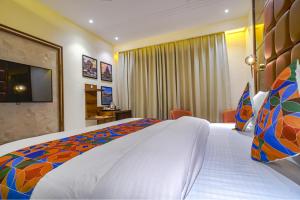 Postel nebo postele na pokoji v ubytování FabHotel Benchmark