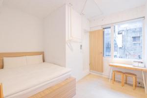 Postel nebo postele na pokoji v ubytování OwlStay Flip Flop Hostel - Garden
