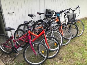 a group of bikes parked next to a house at Zacisze in Hołuczków