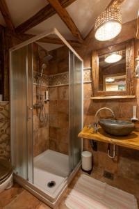 a bathroom with a shower and a sink at Central Bled House in Bled