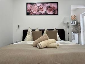 A bed or beds in a room at Attila Studio Apartments