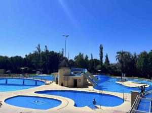 Bazén v ubytování Lovely Home Estudio Jupiter Piscina nebo v jeho okolí