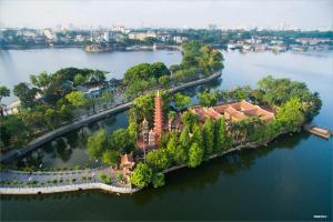 an aerial view of a house on an island in the water at Dnut's House in Hanoi