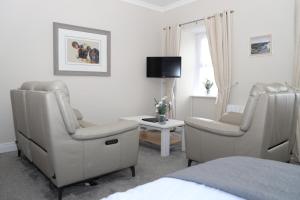 Televiisor ja/või meelelahutuskeskus majutusasutuses Madelines Accommodation