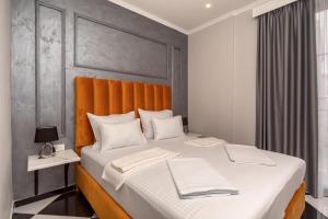 Voodi või voodid majutusasutuse Baba's Hotel & Spa toas