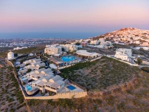 an aerial view of a house on a hill at Smy Santorini Suites & Villas in Pyrgos