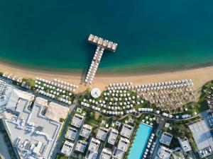 an overhead view of a beach with buildings and the ocean at Voyage Torba Hotel in Torba