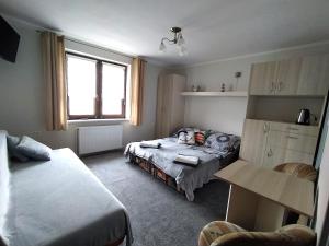 Postel nebo postele na pokoji v ubytování U Zajączka