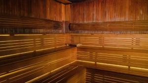 a row of wooden benches in an empty courtroom at Park Inn by Radisson Istanbul Asia Kavacik in Istanbul