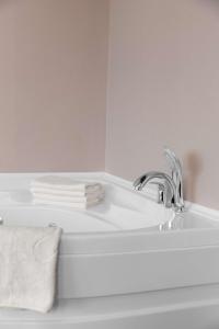 a white bathroom sink with a towel on it at Park Inn by Radisson Istanbul Asia Kavacik in Istanbul