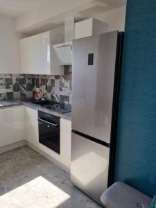 Kuchyňa alebo kuchynka v ubytovaní Apartamenty Morze on Sea