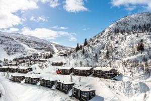 um resort nas montanhas cobertas de neve em Skarsnuten Panorama 46 em Grøndalen