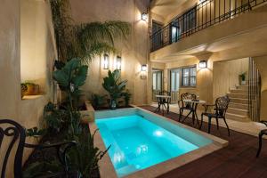 a swimming pool in the middle of a house at Casa di Gaga Luxury Suites in Rethymno