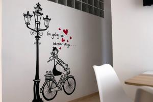 a girl riding a bike near a street light at Mi UNIVERSO in San Fernando