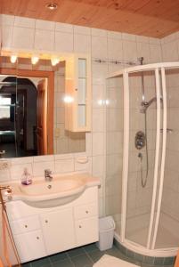 a bathroom with a sink and a shower at Schuistlhof in Sillian