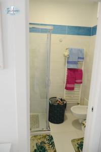 a bathroom with a shower and a toilet at Indiveri holiday apartaments Melissa by STHEY in Polignano a Mare