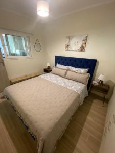 Postel nebo postele na pokoji v ubytování Kaldis Apartment
