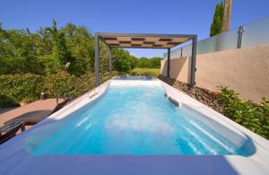 a swimming pool in the middle of a house at Holiday house SEA & SUN RESIDENCE in Rasopasno