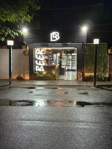 a store with a sign on the front of it at night at BEST ROOM 4 in Yerevan